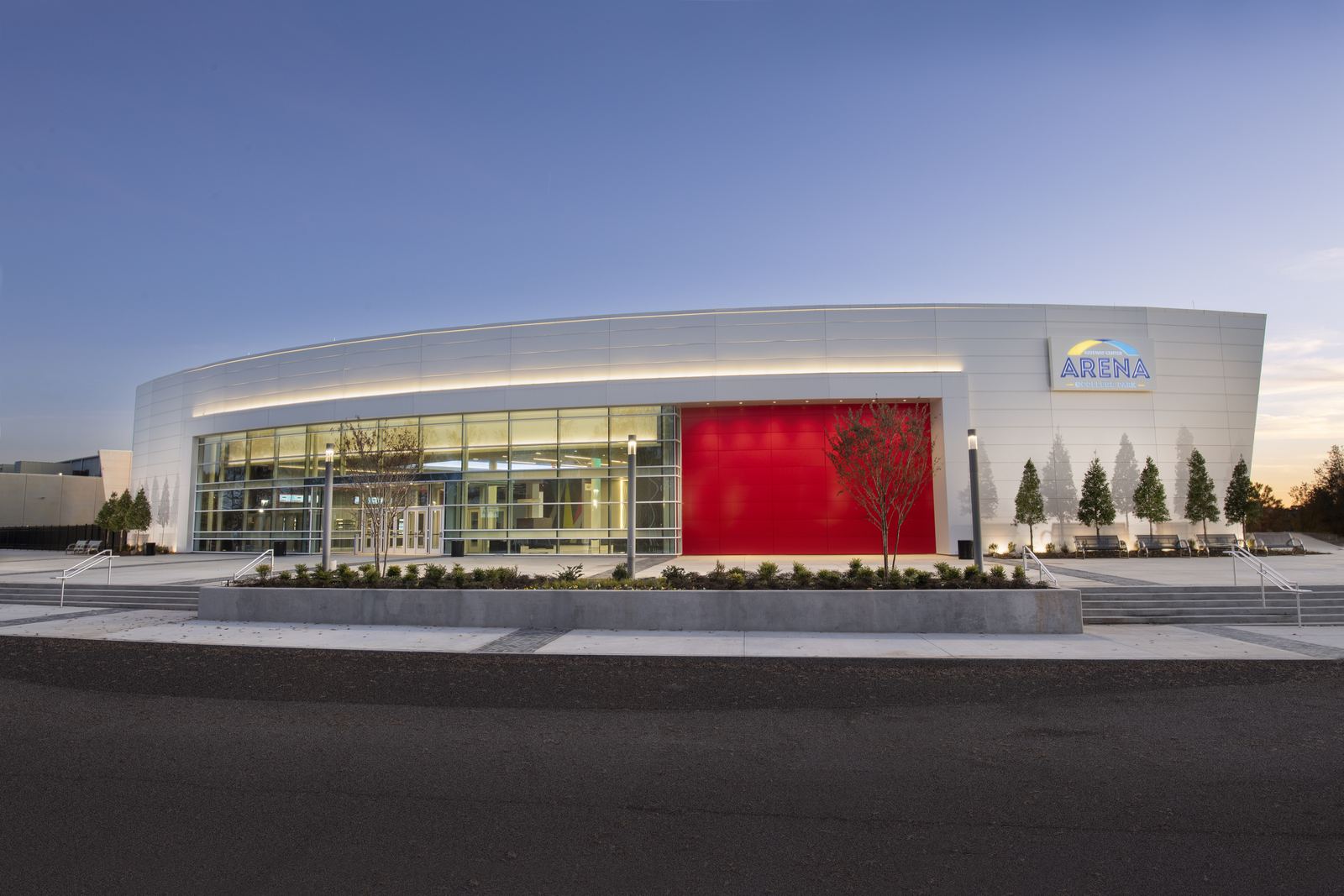 Modern exterior of Gateway Center Arena in College Park at twilight